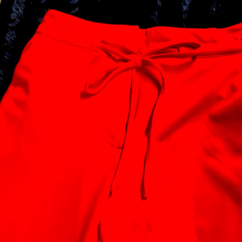 Red dress slacks elastic in the back for comfort. Cuffed leg at ankle.